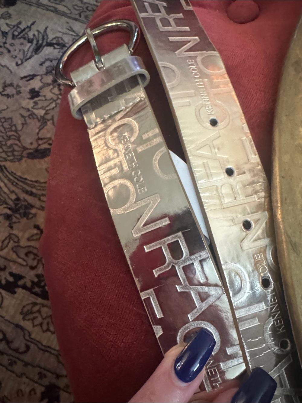 Kenneth Cole Shiny Silver Embossed Logo Belt with Round Buckle
